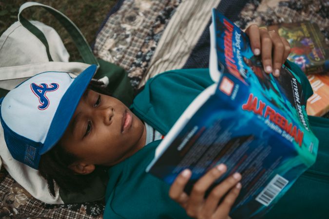 Son reading outdoors